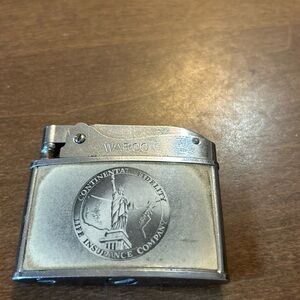 Vintage WARCO lighter with Statue of Liberty.